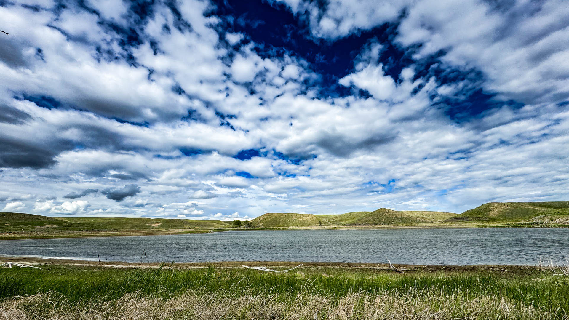 lake and high clouds near shelby, mt